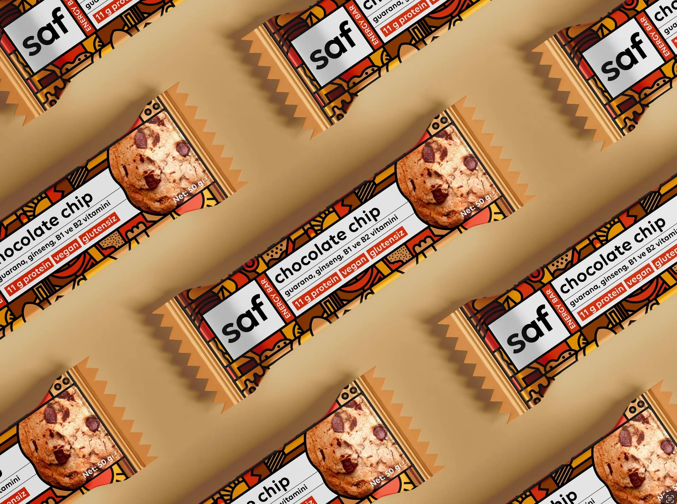 Saf chocolate chip protein bars in illustrated wrappers, laid diagonally on a sand-coloured background.